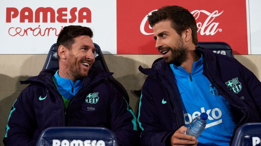 Gerard Pique with Leo Messi