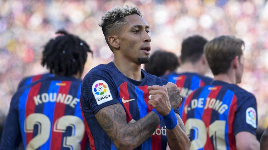 Barcelona players celebrating after scoring a goal against Valencia