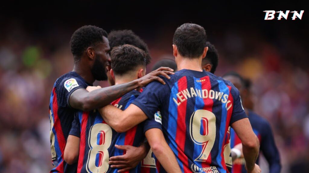 Barcelona players celebrate a goal