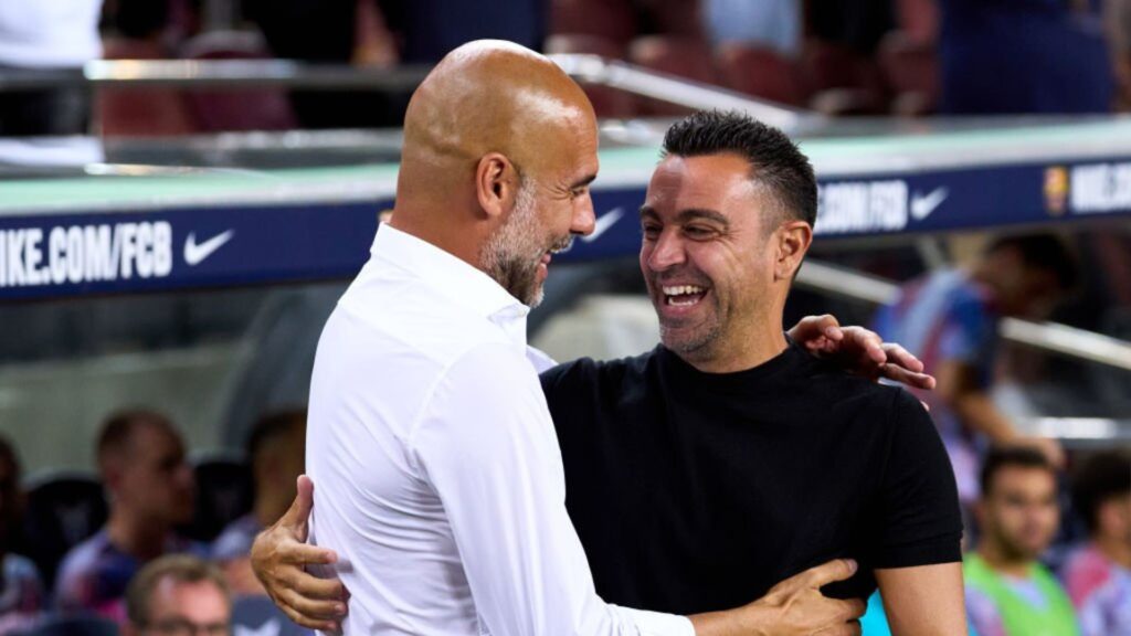 Barcelona head coach Xavi with former Barcelona legend Pep