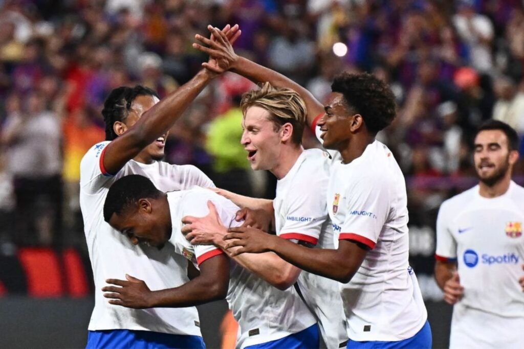 Barcelona players celebrating a goal against AC Milan