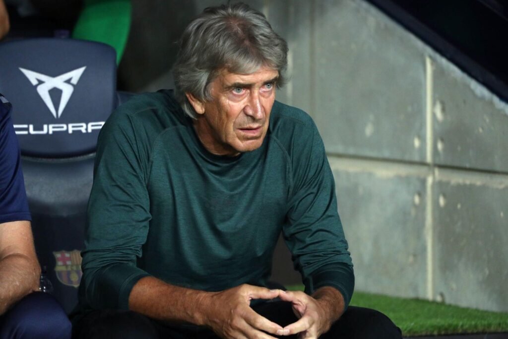 Real Betis head coach Manuel Pellegrini sitting on the bench during the match against FC Barcelona