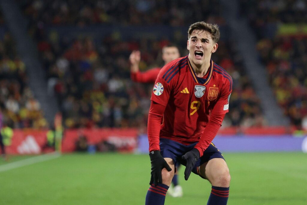 Barcelona midfielder Gavi grimaces in pain as he holds his knee during the UEFA EURO 2024 European qualifier match between Spain and Georgia at Jose Zorrilla on November 19, 2023 in Valladolid, Spain.