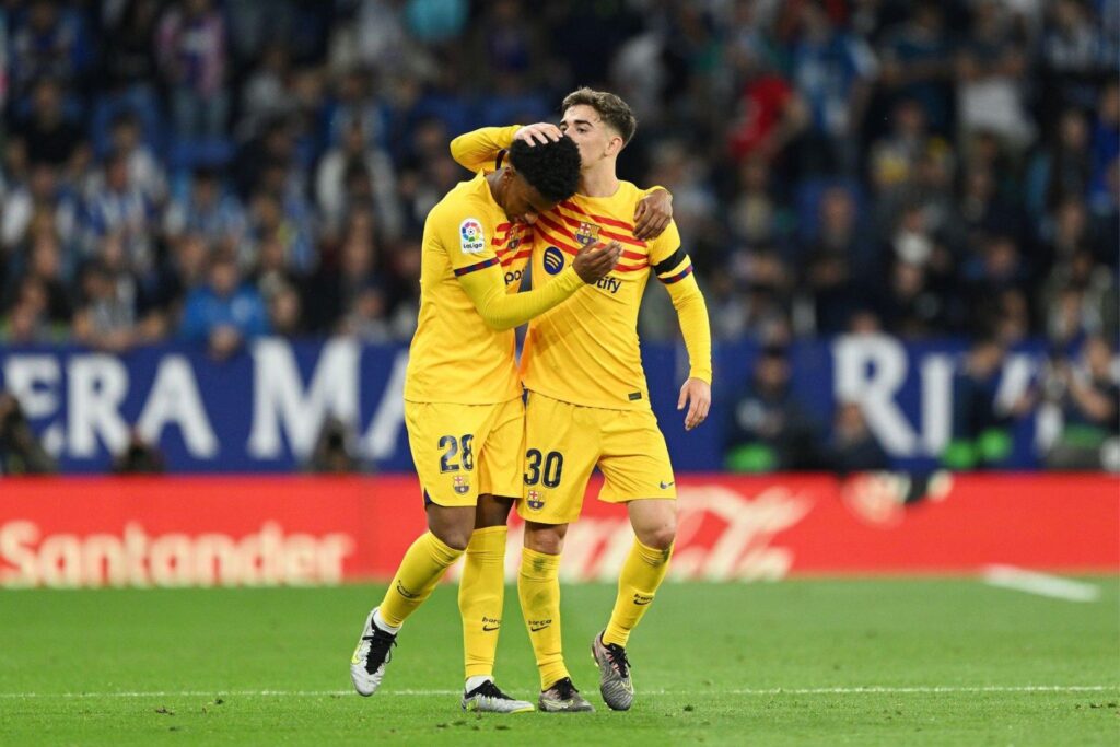 BARCELONA, SPAIN - MAY 14: Alejandro Balde of FC Barcelona celebrates with teammate Gavi after scoring the team's second goal during the LaLiga Santander match between RCD Espanyol and FC Barcelona at RCDE Stadium on May 14, 2023 in Barcelona, Spain.