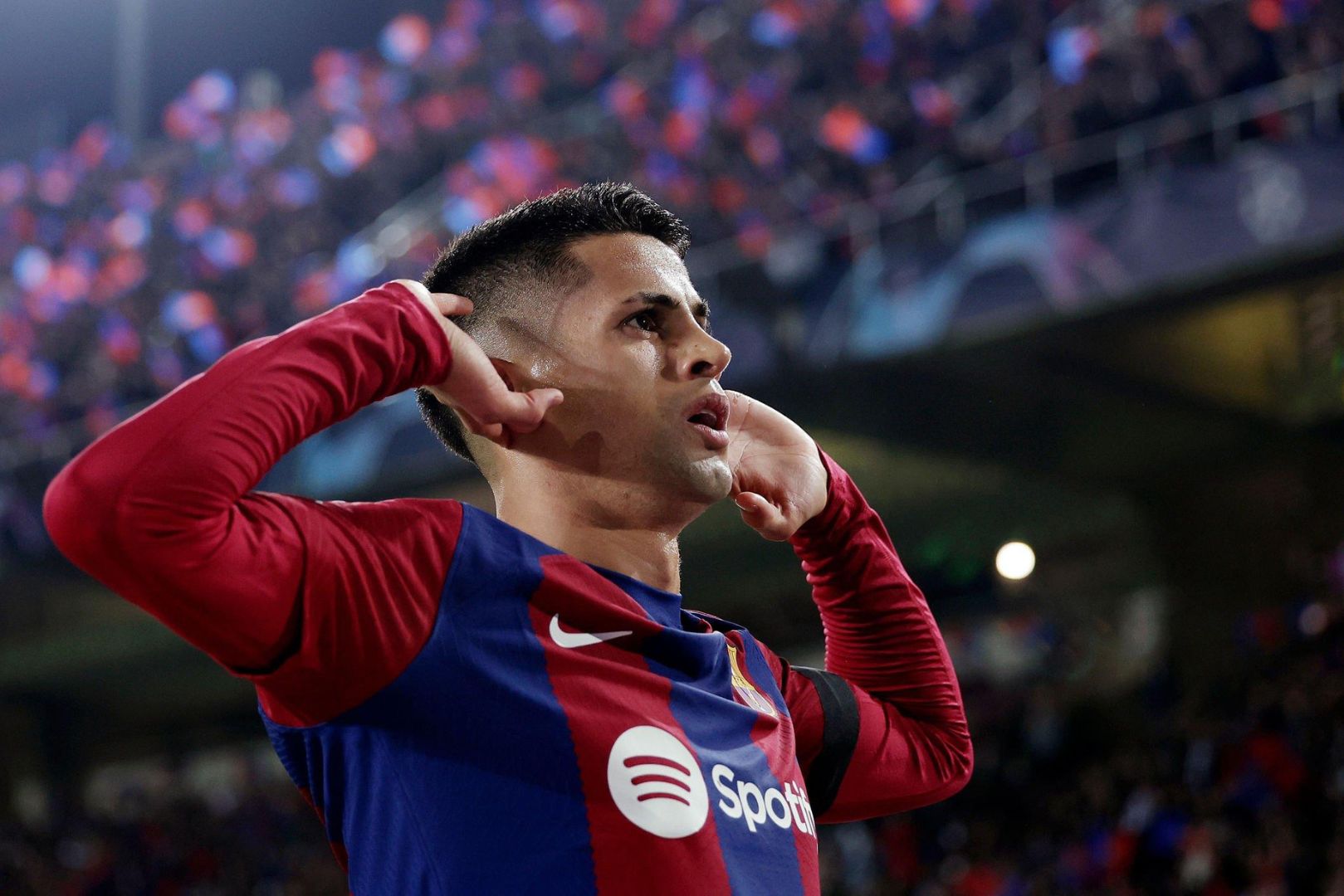 BARCELONA, SPAIN - NOVEMBER 28: Joao Cancelo of FC Barcelona celebrates 1-1 during the UEFA Champions League match between FC Barcelona v FC Porto at the Lluis Companys Olympic Stadium on November 28, 2023 in Barcelona Spain.