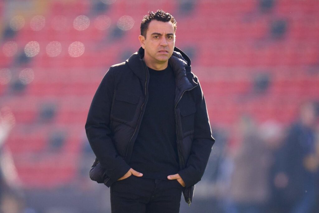 MADRID, SPAIN - NOVEMBER 25: Head coach Xavi Hernandez of FC Barcelona inspects the pitch prior to the LaLiga EA Sports match between Rayo Vallecano and FC Barcelona at Estadio de Vallecas on November 25, 2023 in Madrid, Spain.