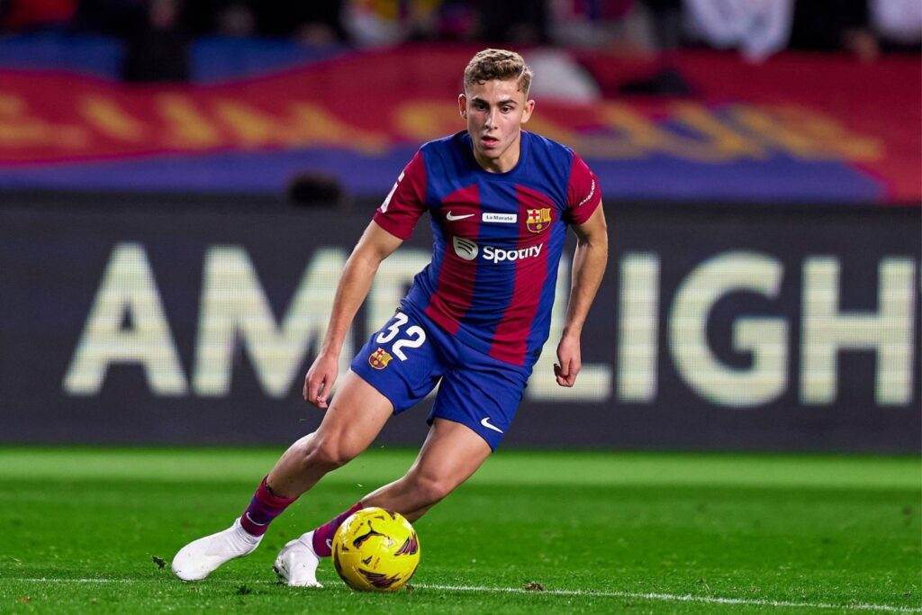 BARCELONA, SPAIN - DECEMBER 10: Fermin Lopez of FC Barcelona with the ball during the LaLiga EA Sports match between FC Barcelona and Girona FC at Estadi Olimpic Lluis Companys on December 10, 2023 in Barcelona, Spain.