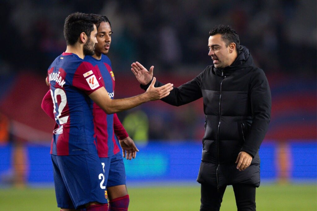 BARCELONA, SPAIN - DEC 3: Xavi Hernandez of FC Barcelona (R) during the Spanish "La Liga" league football match between FC Barcelona vs Atletico de Madrid at the Lluis Companys stadium in Barcelona, Spain on December 3, 2023.