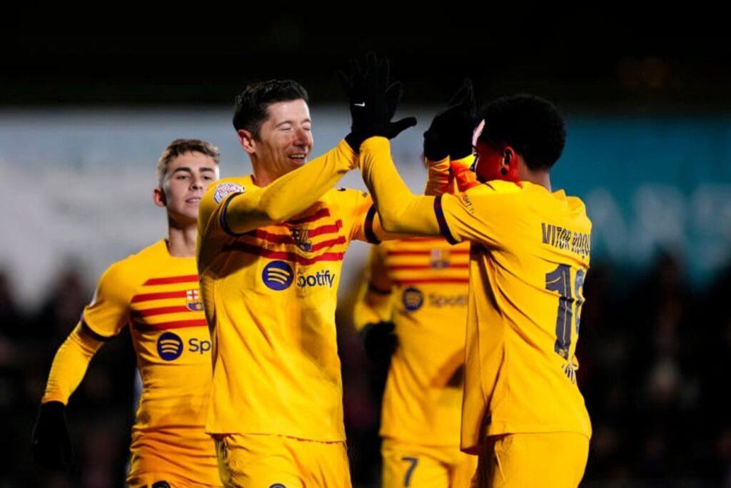 Robert Lewandowski centre-forward of Barcelona and Poland celebrates after scoring his sides first goal with Vitor Roque centre-forward of Barcelona and Brazil during the Copa Del Rey match between UD Barbastro and FC Barcelona at Campo Municipal de Deportes on January 7, 2024 in Barbastro, Spain.