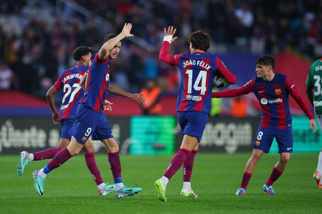 BARCELONA, SPAIN - NOVEMBER 12: Robert Lewandowski of FC Barcelona celebrates with Joao Felix of FC Barcelona after scoring the team's first goal during the LaLiga EA Sports match between FC Barcelona and Deportivo Alaves at Estadi Olimpic Lluis Companys on November 12, 2023 in Barcelona, Spain.