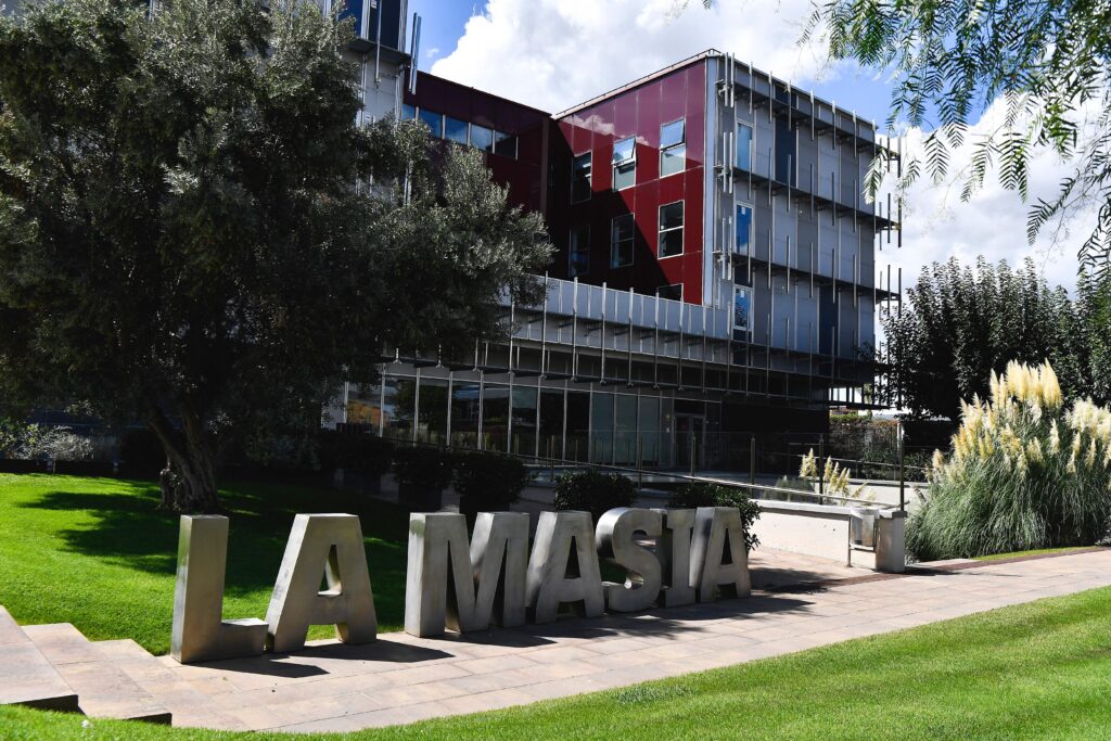 The main entrance of La Masia ( Famed FC Barcelona academy ) Residence, Oriol Tort Education Center, in Sant Joan Despi is pictured on September 20, 2021. - Many players from Barcelona's youth system go on to have careers in football, as Lionel Messi, Xavi, Andres Iniesta, Sergio Busquets, Carles Puyol, Pep Guardiola or Gerard Pique.