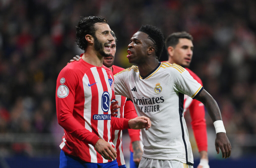 MADRID, SPAIN - JANUARY 18: Mario Hermoso of Atletico Madrid and Vinicius Junior of Real Madrid interact during the Copa del Rey Round of 16 match between Atletico Madrid and Real Madrid CF at Civitas Metropolitano Stadium on January 18, 2024 in Madrid, Spain.