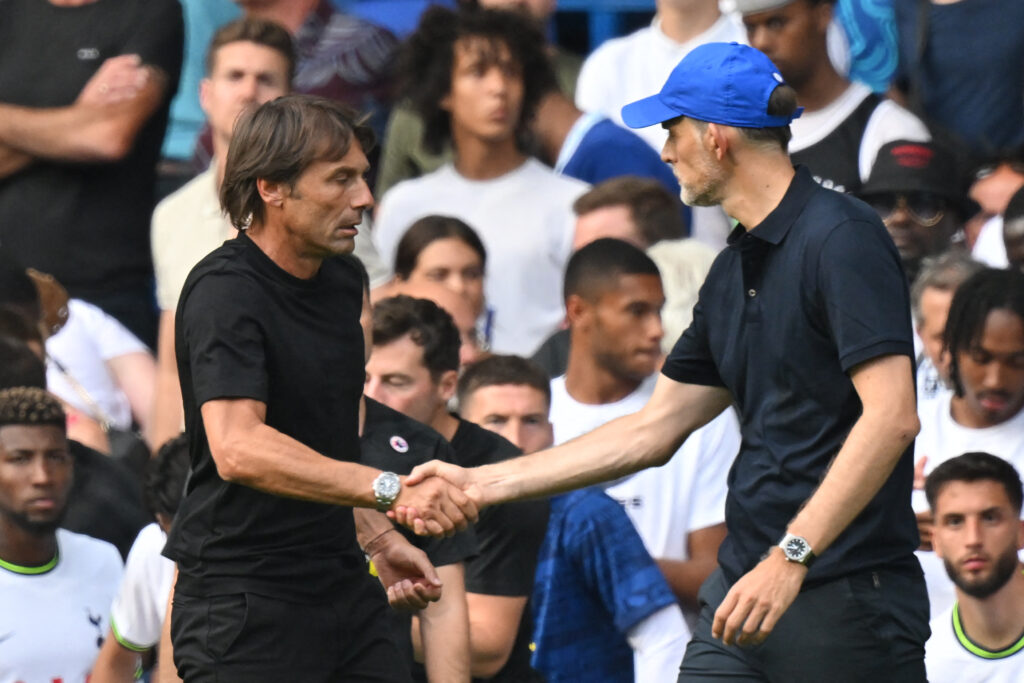 Tottenham Hotspur's Italian head coach Antonio Conte (L) and Chelsea's German head coach Thomas Tuchel (R) shake hands after the English Premier League football match between Chelsea and Tottenham Hotspur at Stamford Bridge in London on August 14, 2022. - The game finished 2-2. - RESTRICTED TO EDITORIAL USE. No use with unauthorized audio, video, data, fixture lists, club/league logos or 'live' services. Online in-match use limited to 120 images. An additional 40 images may be used in extra time. No video emulation. Social media in-match use limited to 120 images. An additional 40 images may be used in extra time. No use in betting publications, games or single club/league/player publications. (Photo by Glyn KIRK / AFP) / RESTRICTED TO EDITORIAL USE. No use with unauthorized audio, video, data, fixture lists, club/league logos or 'live' services. Online in-match use limited to 120 images. An additional 40 images may be used in extra time. No video emulation. Social media in-match use limited to 120 images. An additional 40 images may be used in extra time. No use in betting publications, games or single club/league/player publications. / RESTRICTED TO EDITORIAL USE. No use with unauthorized audio, video, data, fixture lists, club/league logos or 'live' services. Online in-match use limited to 120 images. An additional 40 images may be used in extra time. No video emulation. Social media in-match use limited to 120 images. An additional 40 images may be used in extra time. No use in betting publications, games or single club/league/player publications.