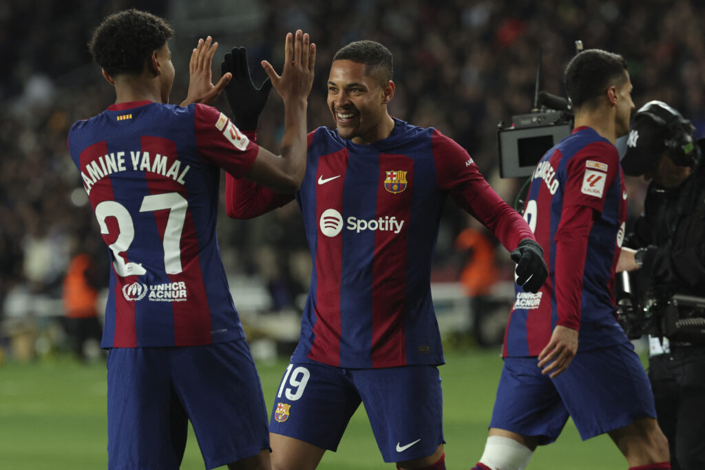 Barcelona's Brazilian forward #19 Vitor Roque celebrates scoring the opening goal, with Barcelona's Spanish forward #27 Lamine Yamal during the Spanish league football match between FC Barcelona and CA Osasuna at the Estadi Olimpic Lluis Companys in Barcelona on January 31, 2024.