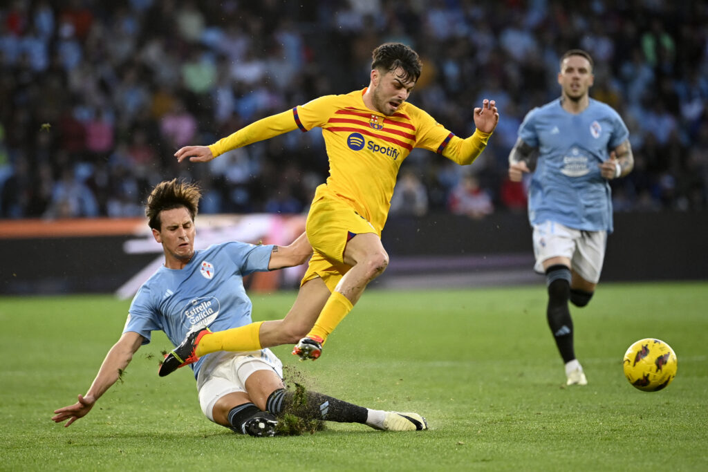 Celta Vigo's Argentinian midfielder #09 Tadeo Allende vies with Barcelona's Spanish midfielder #08 Pedri during the Spanish league football match between RC Celta de Vigo and FC Barcelona at the Balaidos stadium in Vigo on February 17, 2024.