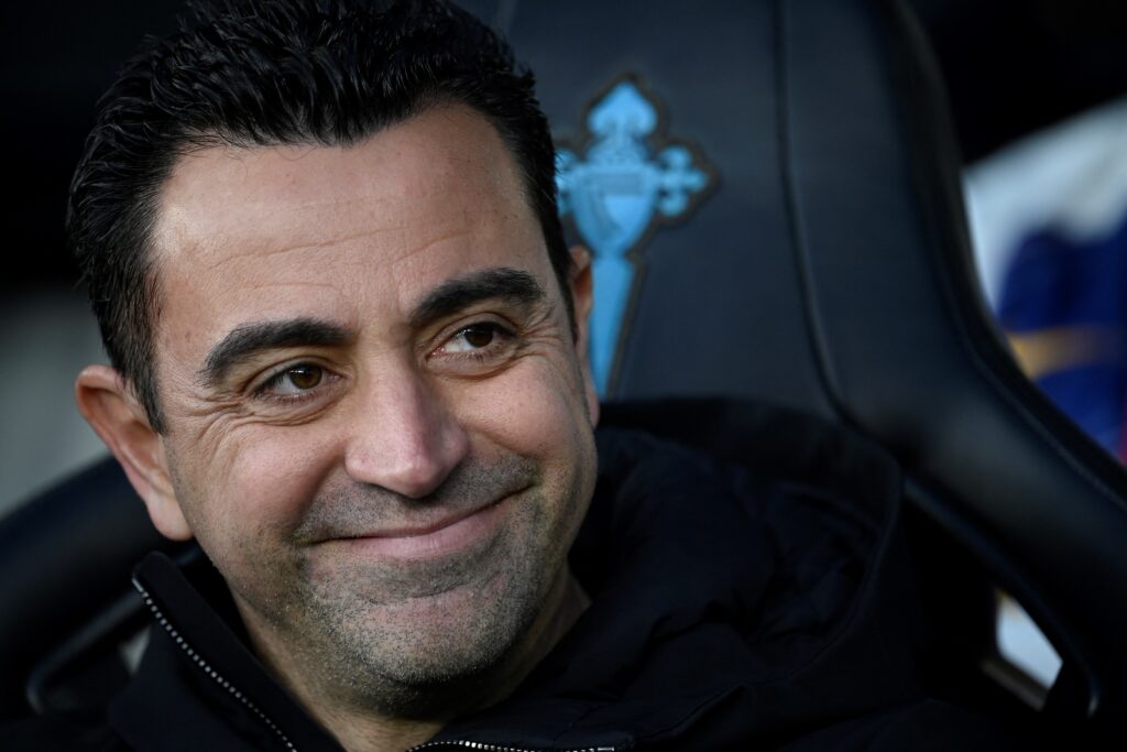 Barcelona's Spanish coach Xavi smiles on the sidelines prior the Spanish league football match between RC Celta de Vigo and FC Barcelona at the Balaidos stadium in Vigo on February 17, 2024.