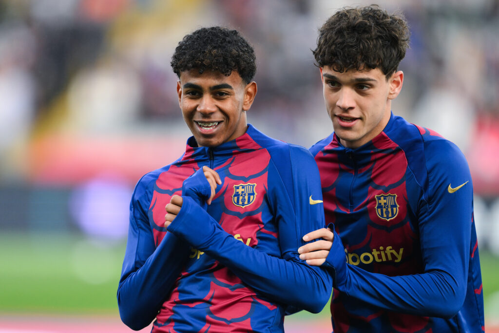 BARCELONA, SPAIN - FEBRUARY 24: Lamine Yamal of FC Barcelona and his team mate Hector Fort look on prior to the LaLiga EA Sports match between FC Barcelona and Getafe CF at Estadi Olimpic Lluis Companys on February 24, 2024 in Barcelona, Spain.