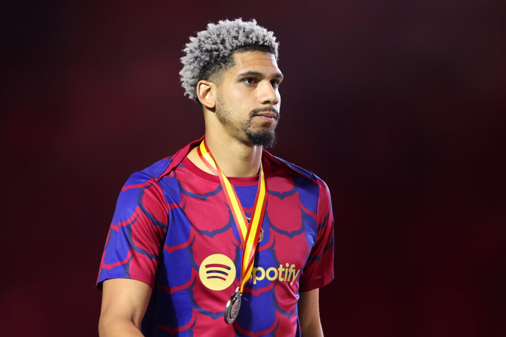 RIYADH, SAUDI ARABIA - JANUARY 14: Ronald Araujo of FC Barcelona looks dejected with his runners-up medal after the team's defeat in the Super Copa de España Final match between Real Madrid and FC Barcelona on January 14, 2024 in Riyadh, Saudi Arabia.