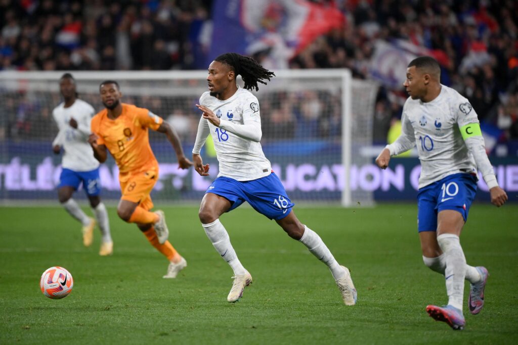 France's midfielder Khephren Thuram (C) runs with the ball during the UEFA Euro 2024 qualification football match between France and Netherlands at the Stade de France in Saint-Denis, north of Paris, on March 24, 2023.