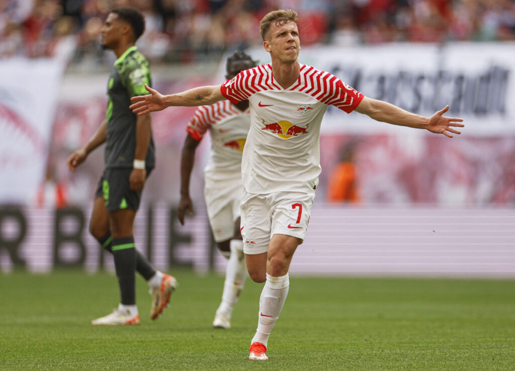 Leipzig's Spanish forward #07 Dani Olmo celebrates his 1-0 during the German first division Bundesliga football match RB Leipzig v VfL Wolfsburg in Leipzig, eastern Germany on April 13, 2024.