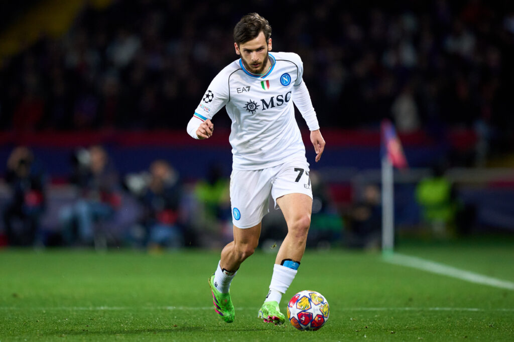 BARCELONA, SPAIN - MARCH 12: Khvicha Kvaratskhelia of SSC Napoli runs with the ball during the UEFA Champions League 2023/24 round of 16 second leg match between FC Barcelona and SSC Napoli at Estadi Olimpic Lluis Companys on March 12, 2024 in Barcelona, Spain.