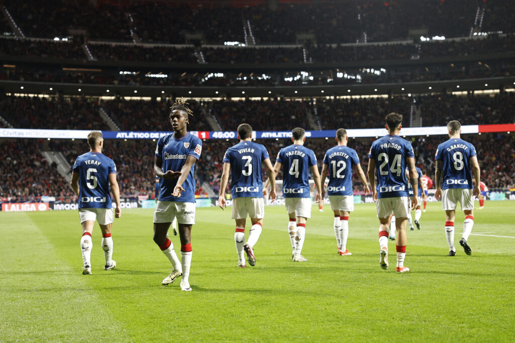 Athletic Bilbao's Spanish forward #11 Nico Williams shows his skin color as he celebrates scoring his team's first goal following alleged racist insults during the Spanish league football match between Club Atletico de Madrid and Athletic Club Bilbao at the Metropolitano stadium in Madrid on April 27, 2024.