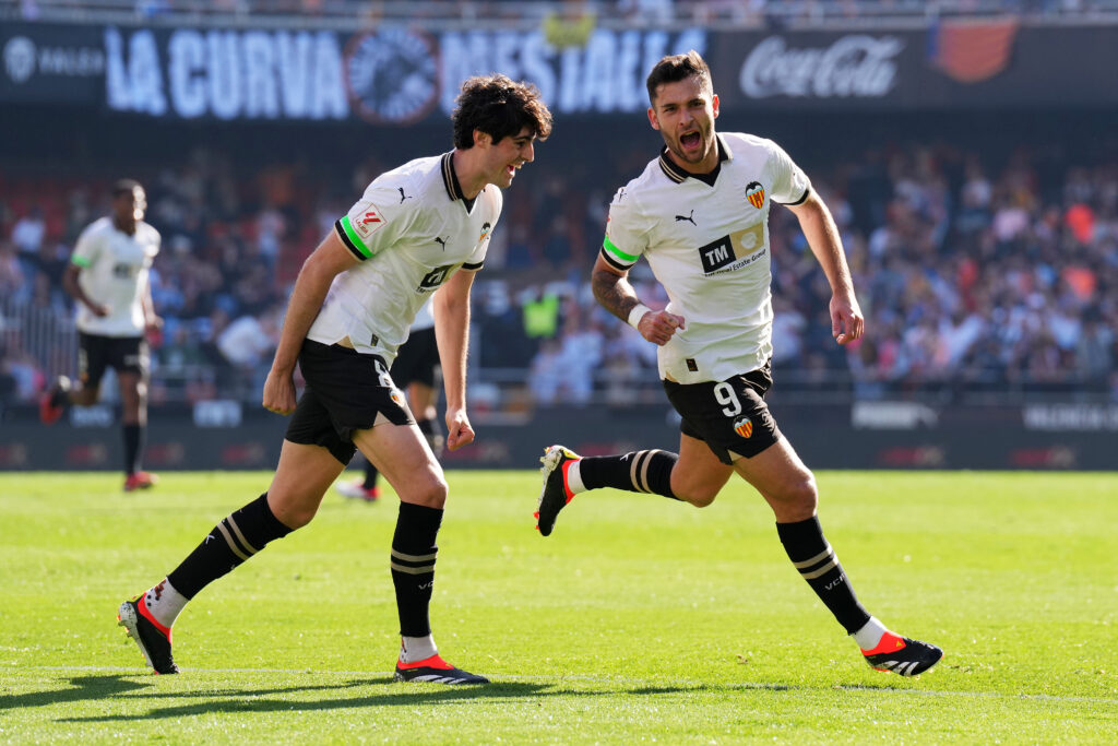 VALENCIA, SPAIN - FEBRUARY 03: Hugo Duro of Valencia CF celebrates scoring his team's first goal with teammate Javi Guerra during the LaLiga EA Sports match between Valencia CF and UD Almeria at Estadio Mestalla on February 03, 2024 in Valencia, Spain.