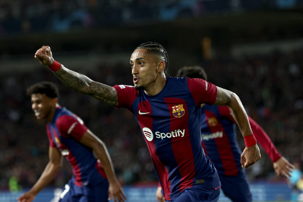 Barcelona's Brazilian forward #11 Raphinha celebrates after scoring his team's first goal during the UEFA Champions League quarter-final second leg football match between FC Barcelona and Paris SG at the Estadi Olimpic Lluis Companys in Barcelona on April 16, 2024.