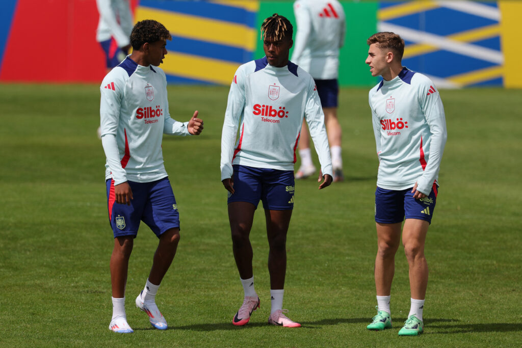 Spain's forward #19 Lamine Yamal (L), Spain's midfielder #17 Nico Williams (C) and Spain's forward #25 Fermin Lopez speak during the training session of Spain's national football team ahead of the UEFA Euro 2024 football Championship at the team's base camp in Donaueschingen on June 13, 2024.