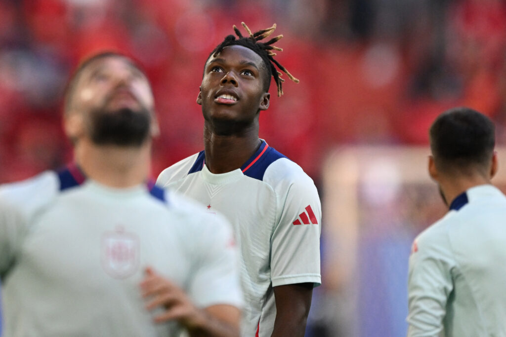 Spain's winger #17 Nico Williams warms up ahead of the UEFA Euro 2024 Group B football match between Albania and Spain at the Duesseldorf Arena in Duesseldorf on June 24, 2024.