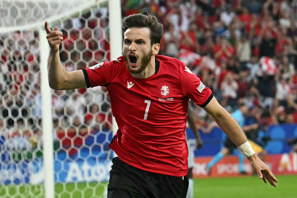 Georgia's forward #07 Khvicha Kvaratskhelia celebrates scoring his team's first goal during the UEFA Euro 2024 Group F football match between Georgia and Portugal at the Arena AufSchalke in Gelsenkirchen on June 26, 2024.