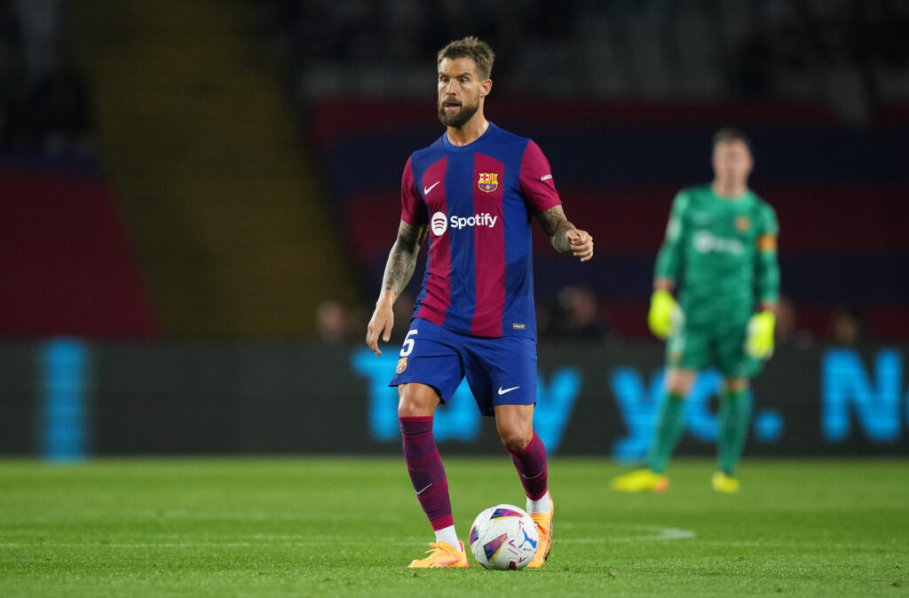 BARCELONA, SPAIN - MAY 13: Inigo Martinez of FC Barcelona runs with the ball during the LaLiga EA Sports match between FC Barcelona and Real Sociedad at Estadi Olimpic Lluis Companys on May 13, 2024 in Barcelona, Spain.