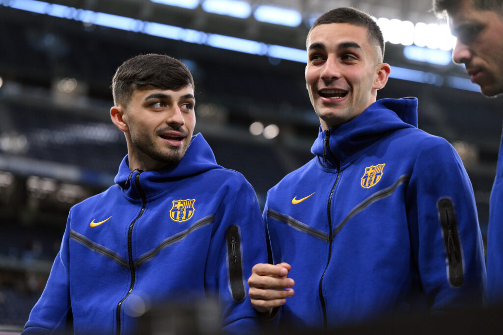 MADRID, SPAIN - APRIL 21: Pedri and Ferran Torres of FC Barcelona interact as they inspect the pitch prior to the LaLiga EA Sports match between Real Madrid CF and FC Barcelona at Estadio Santiago Bernabeu on April 21, 2024 in Madrid, Spain.