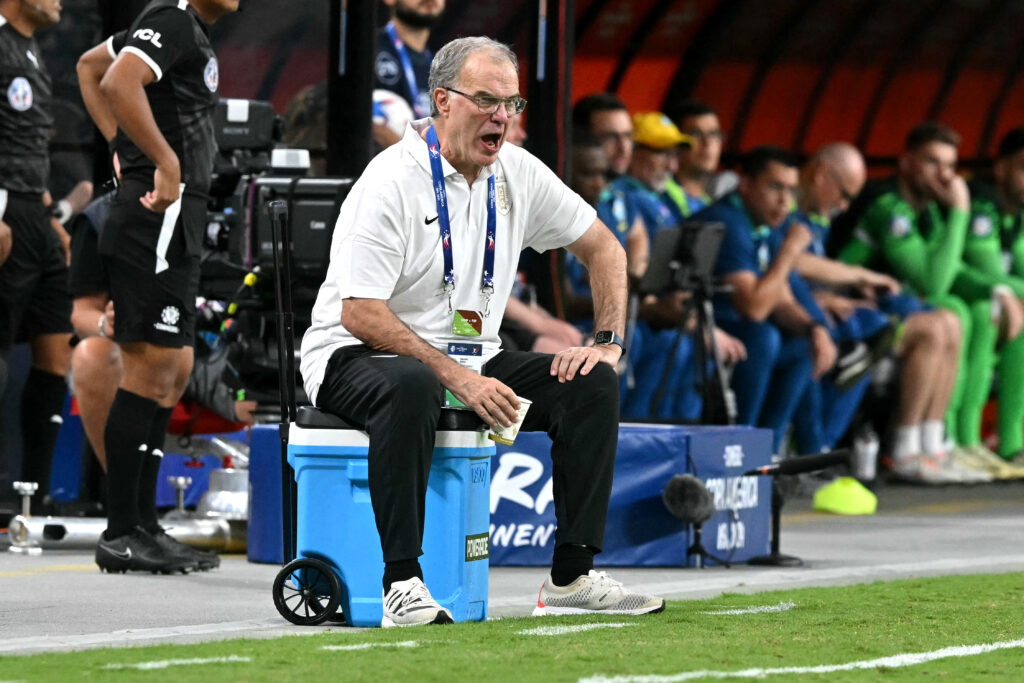 Uruguay's Argentine coach Marcelo Bielsa shouts instructions to his players from the touchline during the Conmebol 2024 Copa America tournament quarterfinal football match between Uruguay and Brazil at Allegiant Stadium in Las Vegas, Nevada on July 6, 2024.