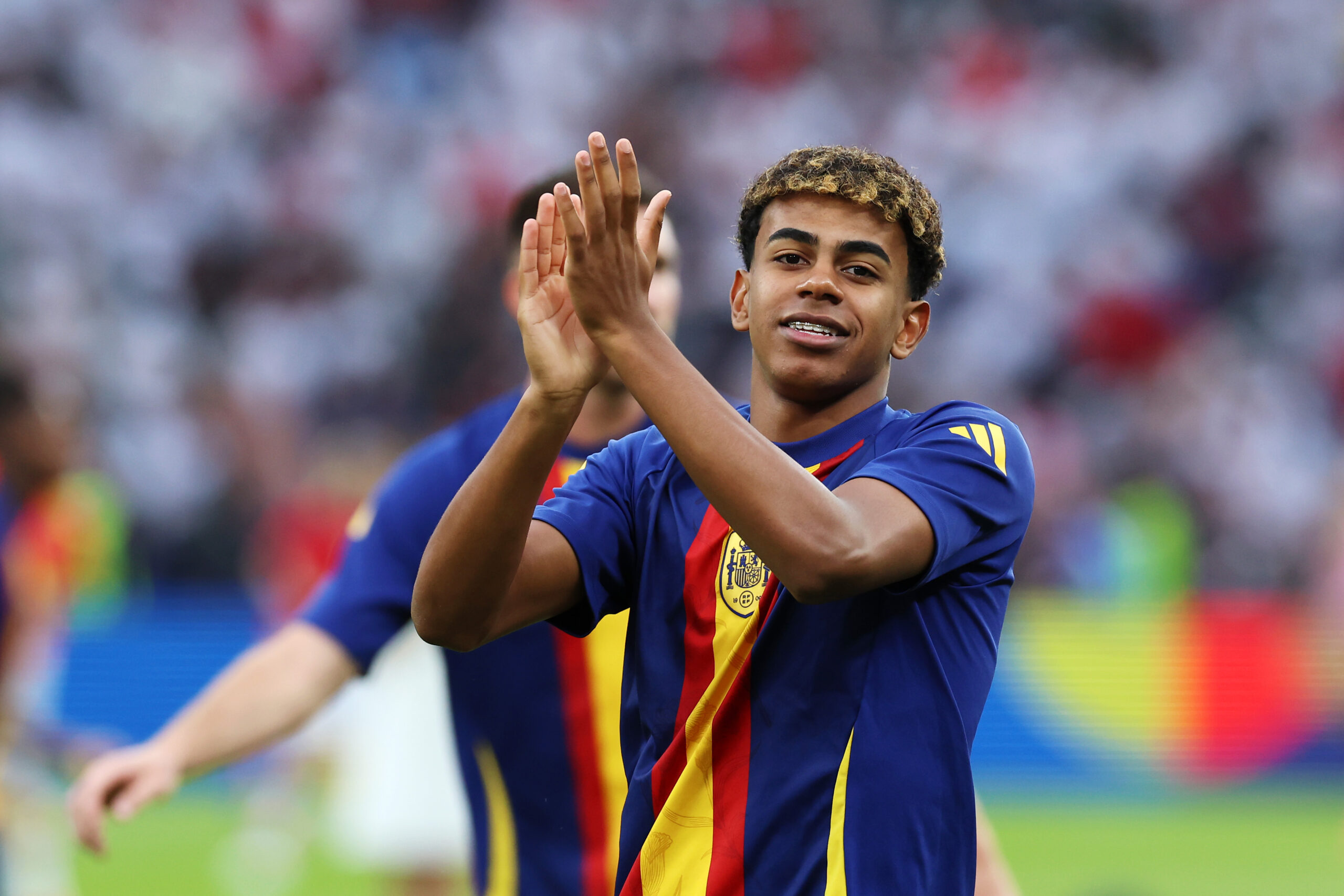 BERLIN, GERMANY - JULY 14: Lamine Yamal of Spain applauds the fans as he warms up prior to the UEFA EURO 2024 final match between Spain and England at Olympiastadion on July 14, 2024 in Berlin, Germany.