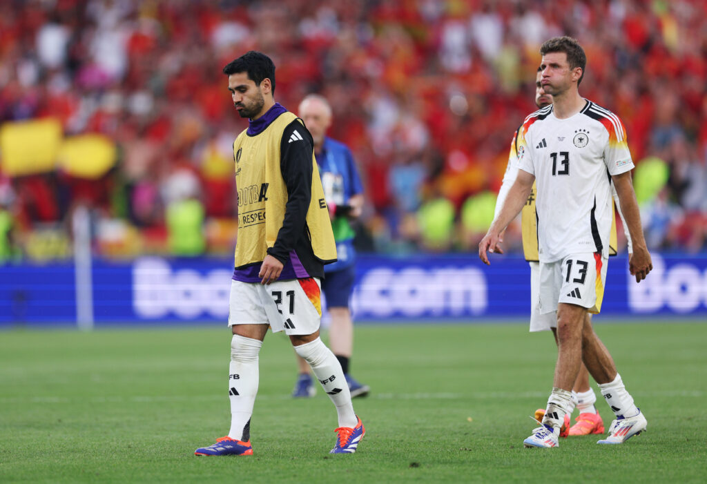 STUTTGART, GERMANY - JULY 05: Ilkay Guendogan and Thomas Mueller of Germany show dejection after the team's defeat and elimination from EURO 2024 in the UEFA EURO 2024 quarter-final match between Spain and Germany at Stuttgart Arena on July 05, 2024 in Stuttgart, Germany.