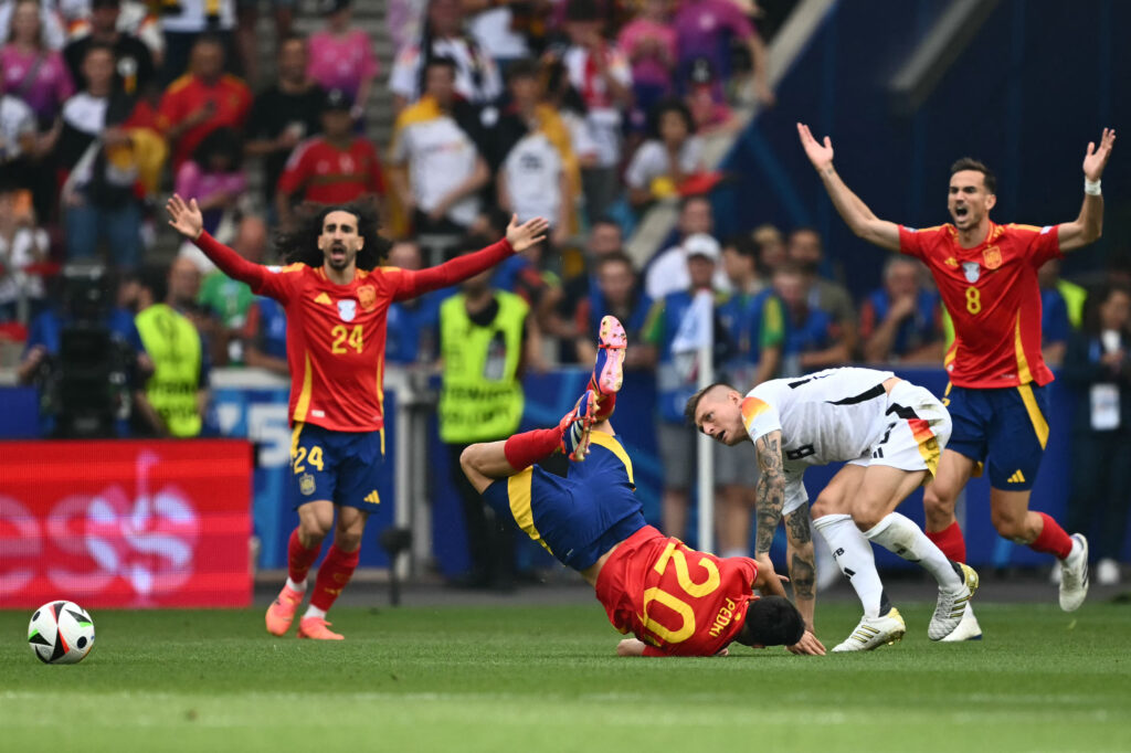 TOPSHOT - Spain's midfielder #20 Pedri (CL) collides with Germany's midfielder #08 Toni Kroos (CR) as Spain's defender #24 Marc Cucurella (L) and Spain's midfielder #08 Fabian Ruiz react during the UEFA Euro 2024 quarter-final football match between Spain and Germany at the Stuttgart Arena in Stuttgart on July 5, 2024.