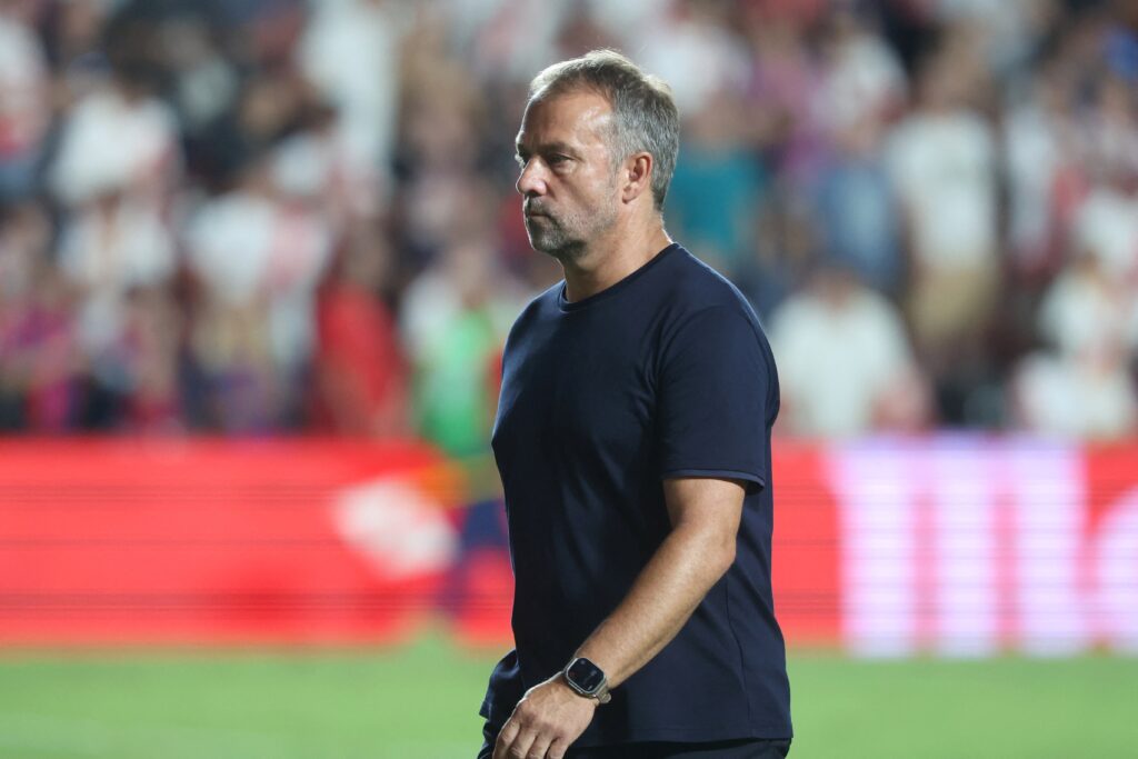 Barcelona's German coach Hansi Flick leaves at the end of the Spanish league football match between Rayo Vallecano de Madrid and FC Barcelona on August 27, 2024. Barcelona won 1-2.