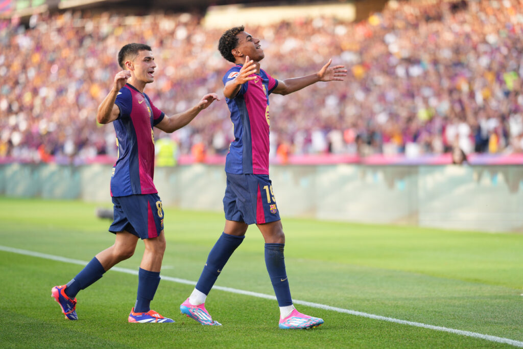 BARCELONA, SPAIN - AUGUST 24: Lamine Yamal of FC Barcelona celebrates scoring his team's first goal with teammate Pedri during the La Liga match between FC Barcelona and Athletic Club at Camp Nou on August 24, 2024 in Barcelona, Spain.