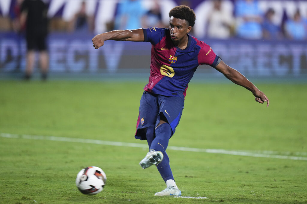 ORLANDO, FLORIDA - JULY 30: Alejandro Balde #3 of FC Barcelona shoots a penalty in extra time of a pre-season match between Manchester City and FC Barcelona at Camping World Stadium on July 30, 2024 in Orlando, Florida.