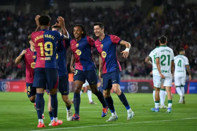 BARCELONA, SPAIN - SEPTEMBER 25: Robert Lewandowski of FC Barcelona celebrates scoring his team's first goal with teammates during the La Liga EA Sports match between FC Barcelona and Getafe CF at Camp Nou on September 25, 2024 in Barcelona, Spain.