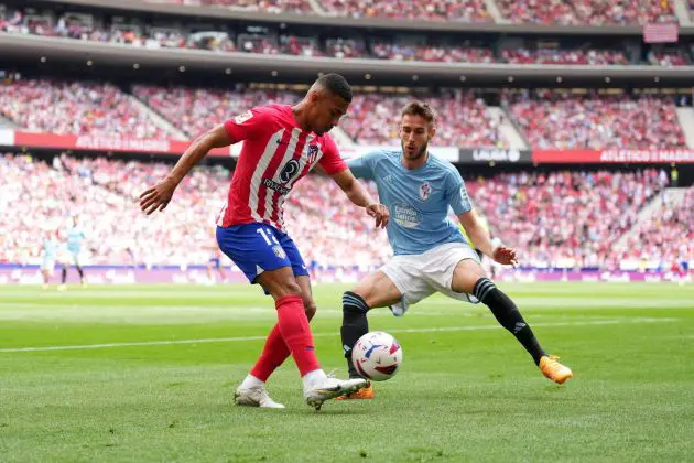 MADRID, SPAIN - MAY 12: Samuel Lino of Atletico Madrid passes the ball whilst under pressure from Oscar Mingueza of Celta Vigo during the LaLiga EA Sports match between Atletico Madrid and Celta Vigo at Civitas Metropolitano Stadium on May 12, 2024 in Madrid, Spain.