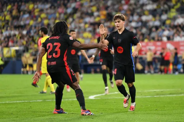 VILLARREAL, SPAIN - SEPTEMBER 22: Pablo Torre of FC Barcelona celebrates scoring his team's third goal with teammate Jules Kounde during the LaLiga match between Villarreal CF and FC Barcelona at Estadio de la Ceramica on September 22, 2024 in Villarreal, Spain.