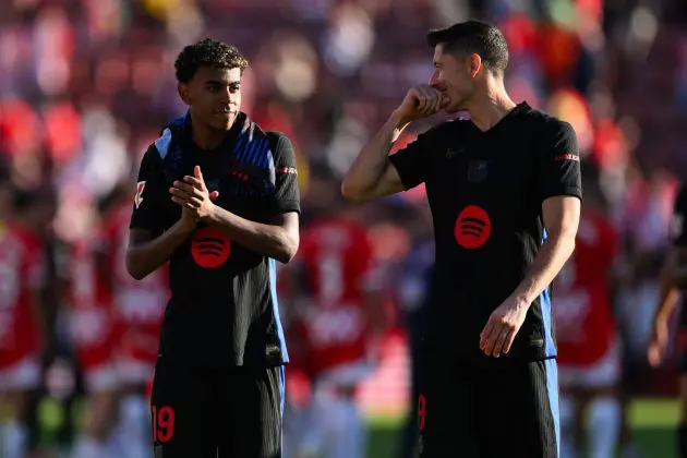 GIRONA, SPAIN - SEPTEMBER 15: Lamine Yamal and Robert Lewandowski of Barcelona FC acknowledge the crowd during the LaLiga match between Girona FC and FC Barcelona at Montilivi Stadium on September 15, 2024 in Girona, Spain.