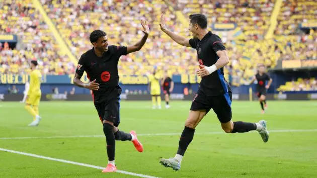 VILLARREAL, SPAIN - SEPTEMBER 22: Robert Lewandowski of FC Barcelona celebrates scoring his team's first goal with teammate Lamine Yamal during the LaLiga match between Villarreal CF and FC Barcelona at Estadio de la Ceramica on September 22, 2024 in Villarreal, Spain.