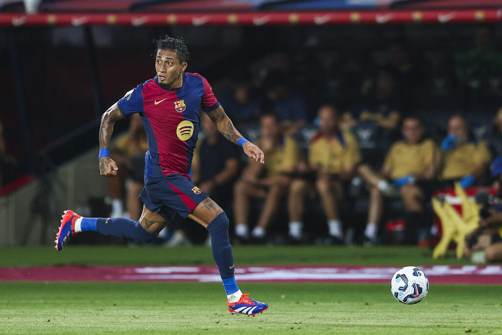 BARCELONA, SPAIN - AUGUST 12: Raphinha of FC Barcelona run with the ball during the Joan Gamper Trophy match between FC Barcelona and AS Monaco at Estadi Olimpic Lluis Companys on August 12, 2024 in Barcelona, Spain.