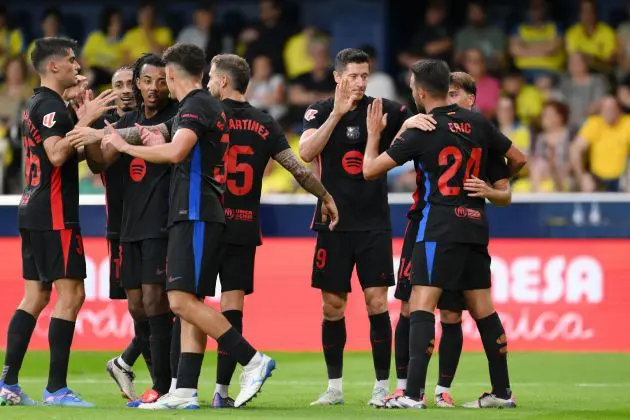 VILLARREAL, SPAIN - SEPTEMBER 22: Robert Lewandowski of FC Barcelona celebrates scoring his team's second goal with teammates during the LaLiga match between Villarreal CF and FC Barcelona at Estadio de la Ceramica on September 22, 2024 in Villarreal, Spain.