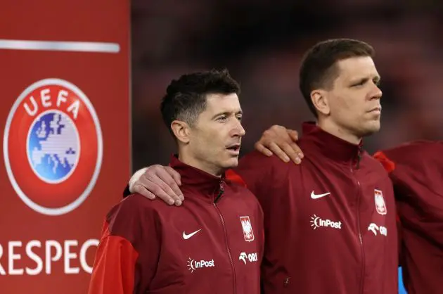 CARDIFF, WALES - MARCH 26: Robert Lewandowski and Wojciech Szczesny of Poland sing the national anthem during the UEFA EURO 2024 Play-Offs semifinal match between Wales and Poland/Estonia at Cardiff City Stadium on March 26, 2024 in Cardiff, Wales.