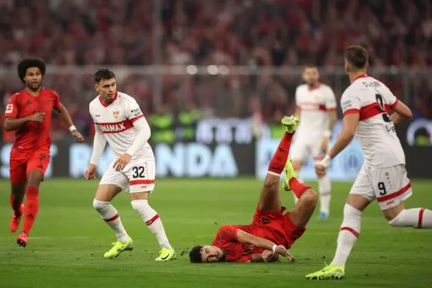 MUNICH, GERMANY - OCTOBER 19: Aleksandar Pavlovic of Bayern Munich is challenged by Fabian Rieder of VfB Stuttgart during the Bundesliga match between FC Bayern München and VfB Stuttgart at Allianz Arena on October 19, 2024 in Munich, Germany.