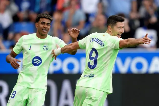 VITORIA-GASTEIZ, SPAIN - OCTOBER 06: Robert Lewandowski of FC Barcelona celebrates scoring his team's second goal with team mate Lamine Yamal during the LaLiga match between Deportivo Alaves and FC Barcelona at Estadio de Mendizorroza on October 06, 2024 in Vitoria-Gasteiz, Spain.